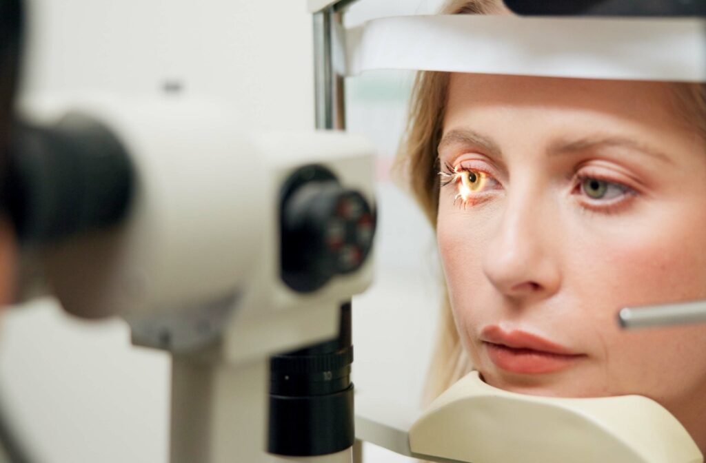 A patient receiving a slit-lamp test during their eye exam to assess their eye health and vision.
