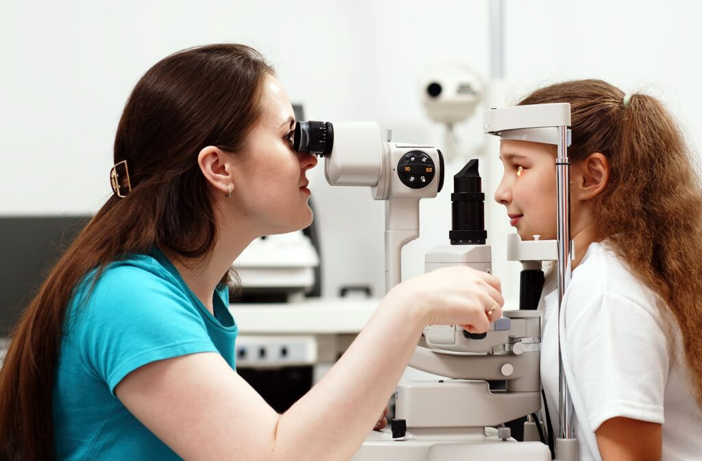 Child sits in an eye doctors office and undergoes eye tests